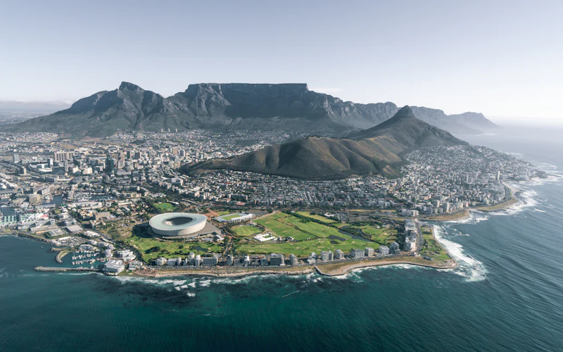 Cape Town with Table Mountain and Lion's Head rising behind the Green Point stadium