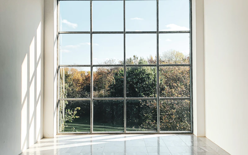 Floor-to-ceiling aluminium-framed windows (representative image)